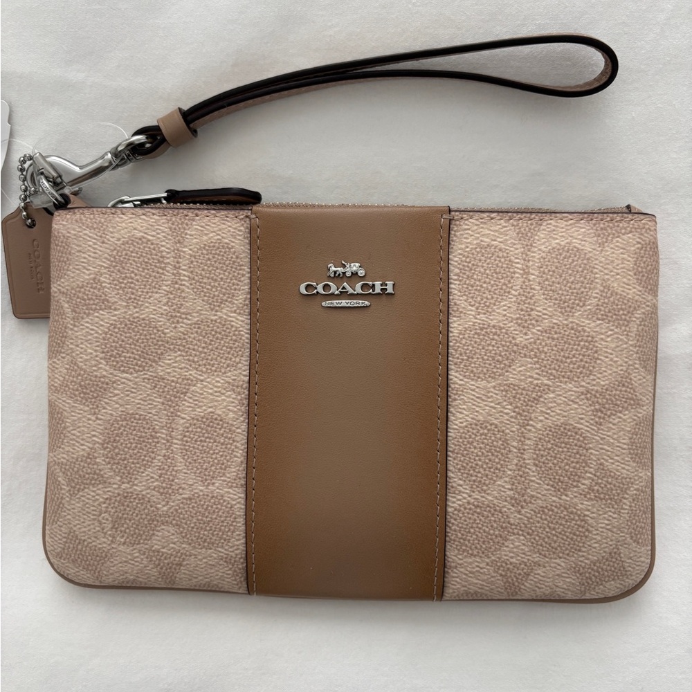 Brand new never used Coach Signature Canvas Wristlet in Taupe and Brown